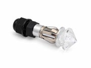 Metallirunko ja kristallilasinen koristeosa tekev&auml;t valosta n&auml;ytt&auml;v&auml;n yksityiskohdan esimerkiksi saunan kiukaan p&auml;&auml;ll&auml;. Kuva tuotettu teko&auml;lyll&auml;.